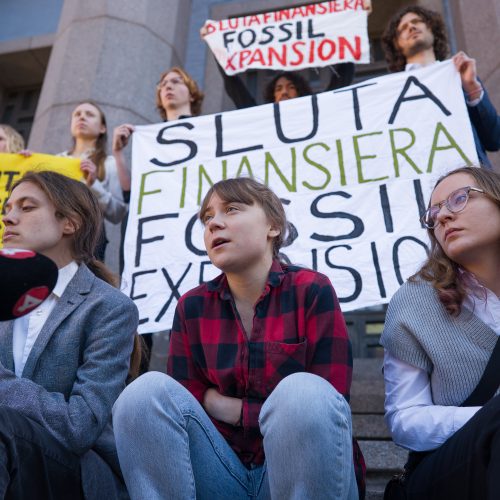 Activists sitting with banners